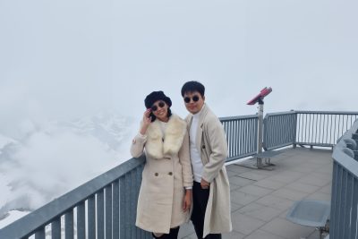 u3143385977_a_photo_of_an_asian_couple_wearing_sunglasses_and_b_c529f444-1496-4881-aab6-893a79792a7b